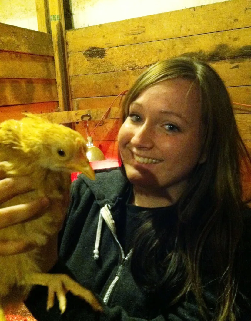 Lindsey, a Veterinary Assistant at Apollo North Animal Hospital, Holding a Chicken